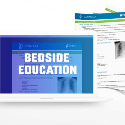 This image features an open laptop displaying the PEPID Bedside Education module on its screen, which is focused on the topic of achalasia. The screen shows detailed patient education content, including basic information and common signs and symptoms, with an endoscopic image of the esophagus. Beside the laptop, there are several printed patient handouts with similar content, highlighting the integration of digital and printed educational resources available through PEPID. The setup is designed to illustrate how healthcare professionals can use these tools to educate their patients about their conditions in a clinical setting.